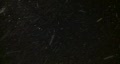 Brightly lit snow drifts against the night sky (High Definition)