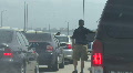 Man Waits Outside Car In Traffic Jam Video