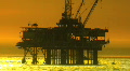 Helicoptor Flying from Oil Rig