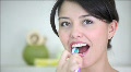 Woman brushing her teeth