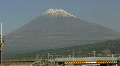 Shinkansen trains pass Mount Fuji