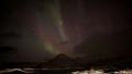 Northern lights behind the clouds - solar storm