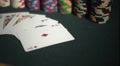 Full House - Aces Full of Kings - Poker Hand with Stacks of Chips at Casino