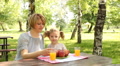 mother and daughter eat and drink