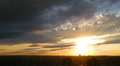 timelapse with beautiful sunset over town