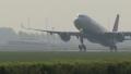 airplane taking off on runway of airport