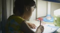Asian kid doing homework