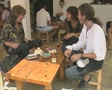 People sitting round table talking and laughing Video