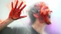 Bloody face slammed against frosted glass