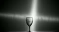 Silhouette of wine poured in a wine glass from a bottle Video