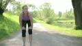Young blond woman taking breath after jogging HD