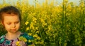 Baby in the flowers. Laugh.
