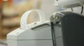 female hand takes checks from the cash register