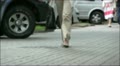 Street scene. Going feet of the woman in trousers Video