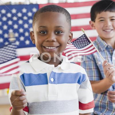 Boys Holding Small American Flags