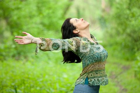 Woman Breathing In Nature