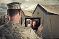Deployed Military Man Chats With Family on Computer