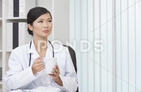 Chinese Female Woman Doctor Drinking Coffee Or Tea