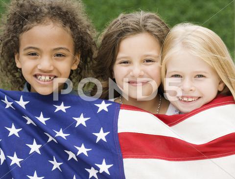 Multi-Ethnic Girls Holding American Flag