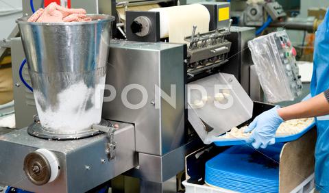 Stock photo of production of meat dumplings