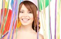 happy teenage party girl with balloons over white