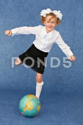 Schoolgirl Kicks Globe As Footballer