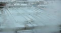Vapour over water sewage treatment tanks with foam on surface Video