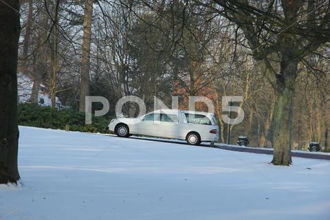 Stock photo of white hearse in the winter