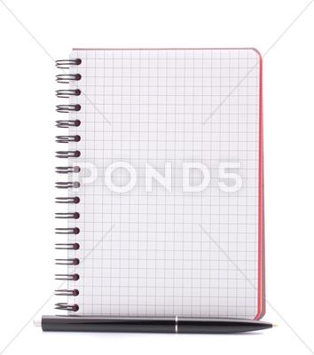 Stock photo of open blank checked notebook with black pen