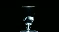 white figured glass rotates on a black background Video