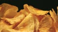 Potato chips in rotation. Macro Horizontal view Video