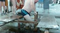 Adult man in ice-hole swimming in Epiphany on January, Russia Video