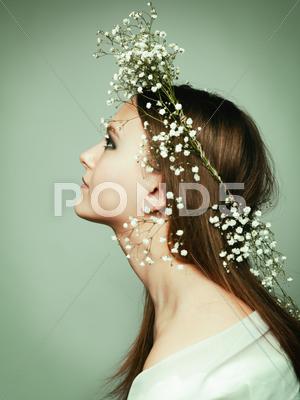 Stock photo of spring portrait girl with wreath of flowers