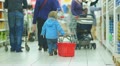 Baby slide shopping basket on floor in supermarket