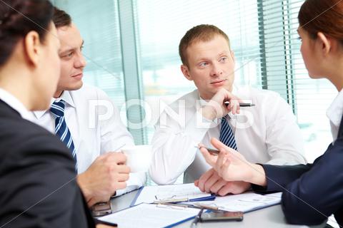 Image Of Confident Colleagues Listening To New Ideas At Meeting