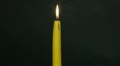 Burning-down yellow candle. Time lapse 1 Video