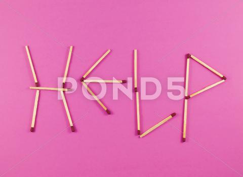 Stock photo of word help made of matchsticks