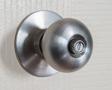 close up shot of stainless steel round ball door knob