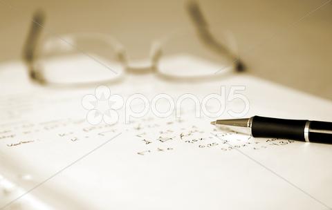 Stock photo of young man doing the maths homework