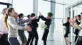 Attractive diverse business team in a light modern office building