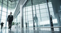 Diverse group of business people in a light and modern office building
