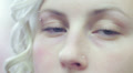 woman looks around with her blue eyes - macro Video