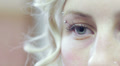 face of a young woman with her blue eye - macro Video