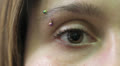 beautiful young woman opens and closes her Brown eye Video
