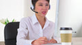 Chinese businesswoman talking to business partner on the phone