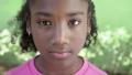 Portrait of happy young african girl looking at camera, smiling
