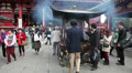People burning aromatic sticks in Incense burner, Asakusa, Japan Video