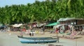 Colourful hats in holiday resort on sandy beach by the sea