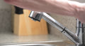 Close up of man washing hands in kitchen sink
