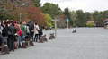 Tourists with guide waiting near Seisho-mon gate, Imperial Palace, Kyoto, Japan Video